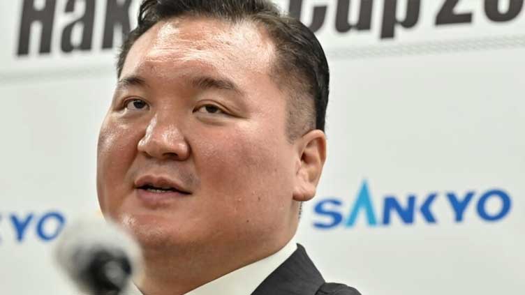 Sumo great Hakuho demoted over protege's bullying