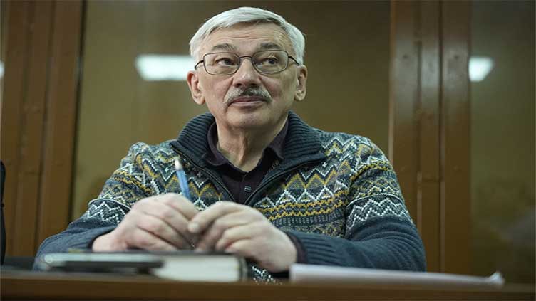 A Russian court sentences the co-chair of a Nobel-winning rights group to 30 months in prison