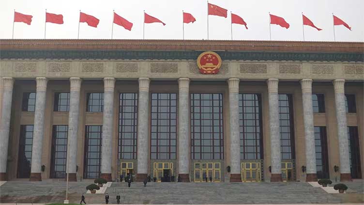 China broadens law on state secrets to include 'work secrets'