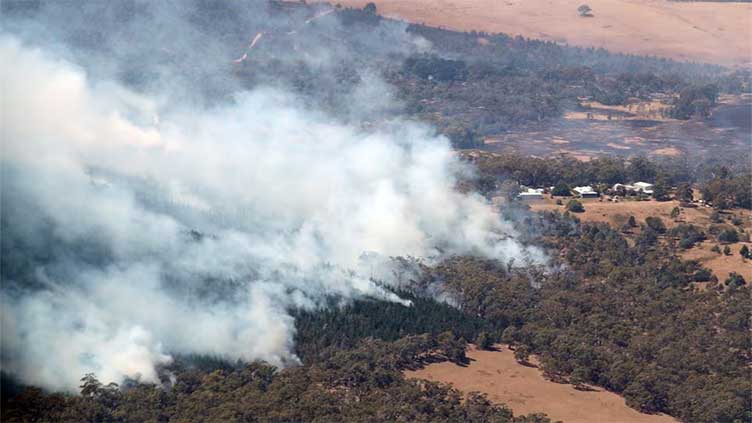 Thousands told to flee homes in Australia amid heat spike, bushfire threat