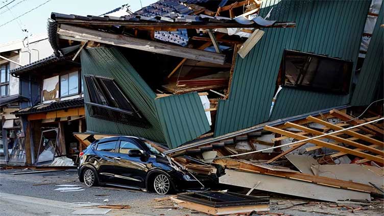 Rescuers rush to reach survivors as 30 dead in Japan quake