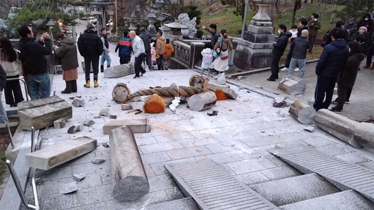 Japan earthquake toll rises to at least 55 as weather hampers rescuers