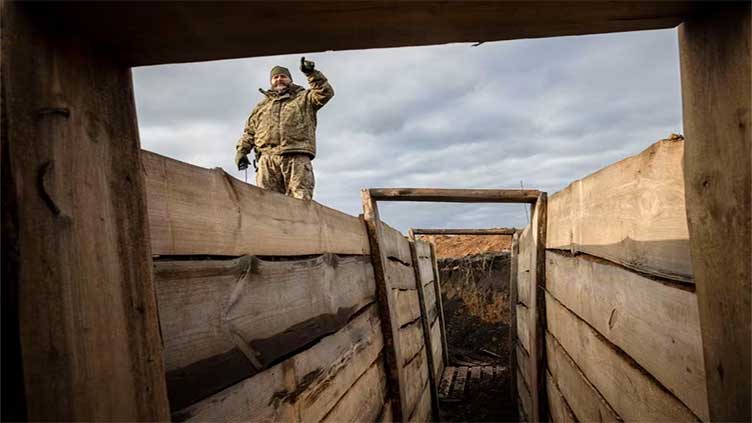 Ukraine builds barricades, digs trenches as focus shifts to defence