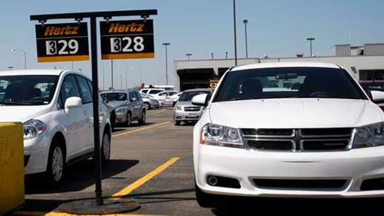 Car rental firm Hertz to sell 20,000 EVs