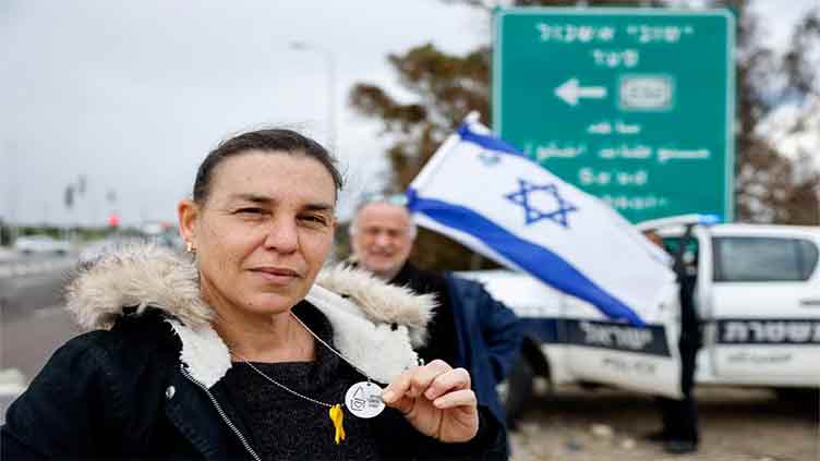 Israelis wear dog tags in solidarity with hostages and each other