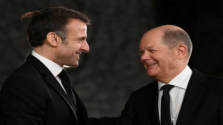 France's Macron hails ties at Schaeuble ceremony