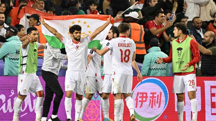 Tajikistan reach Asian Cup knockouts, China on brink of exit