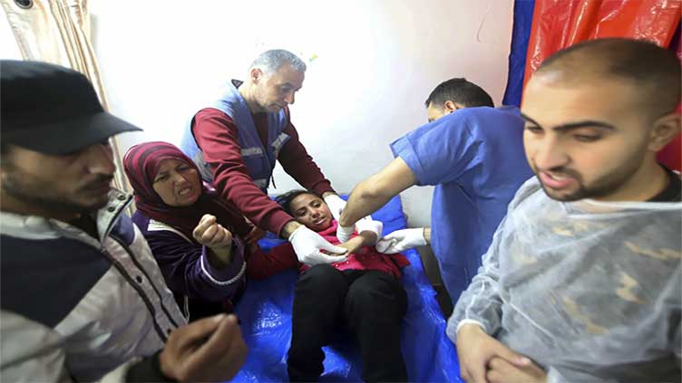 Gaza's Health Ministry blames Israeli troops for deadly shooting as crowd waited for aid