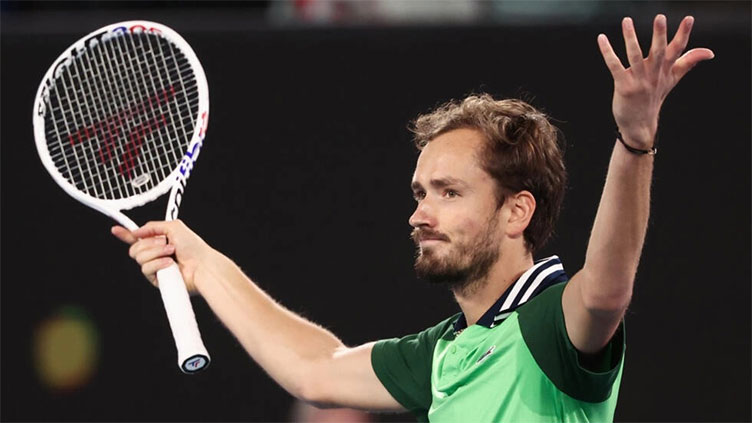 Proud Medvedev battles back from two sets down to make Australian Open final