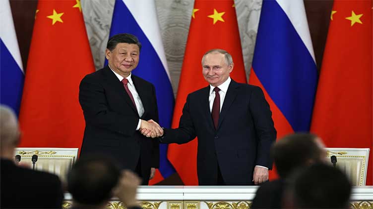 Leaders of Russia and China meet at a Central Asian summit in a show of deepening cooperation