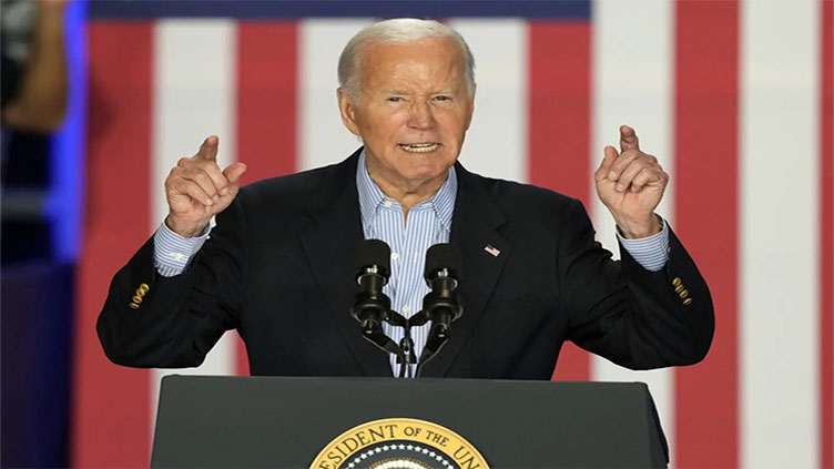 Defiant Biden tells Democrats he is 'staying in the race'