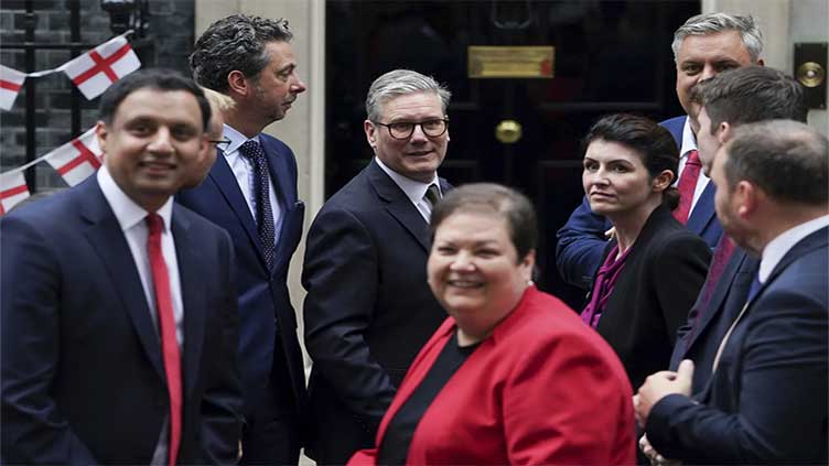 Hundreds of newly elected lawmakers troop excitedly into UK Parliament 