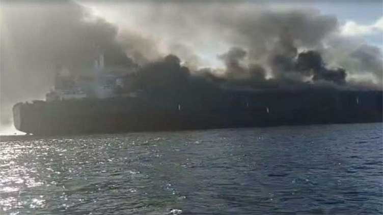 Oil tankers on fire after colliding off Singapore, crew members rescued