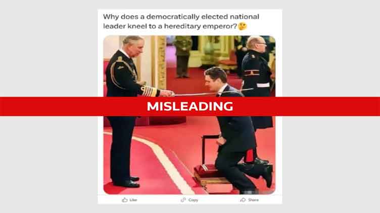 Old picture showing UK PM kneeling before UK monarch is fake 