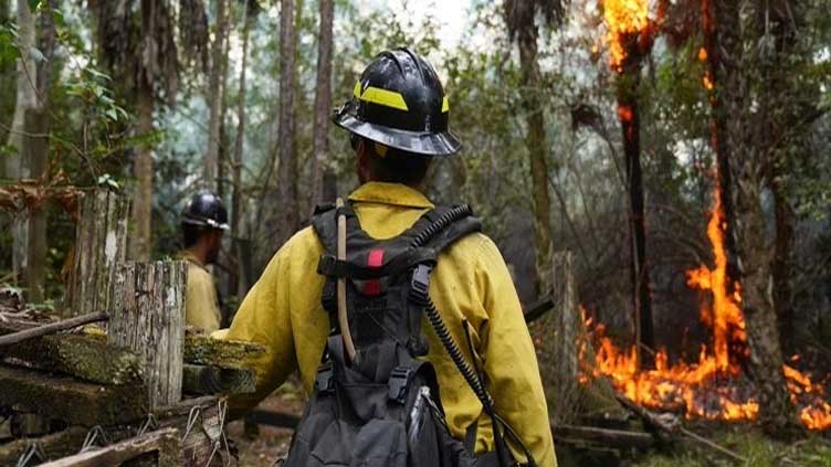 Firefighters make progress against massive blaze in California ahead of warming weather