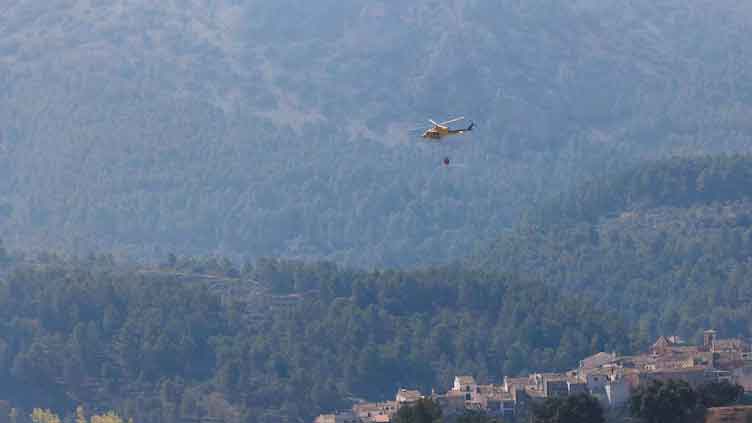 Wildfires rage in Spain as heatwave peaks