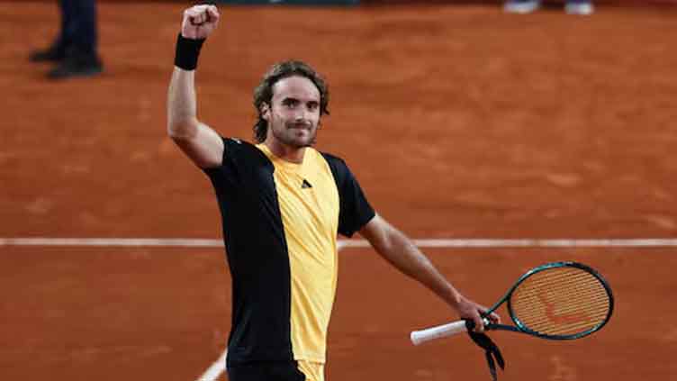 Tsitsipas glides past Zhang into French Open fourth round