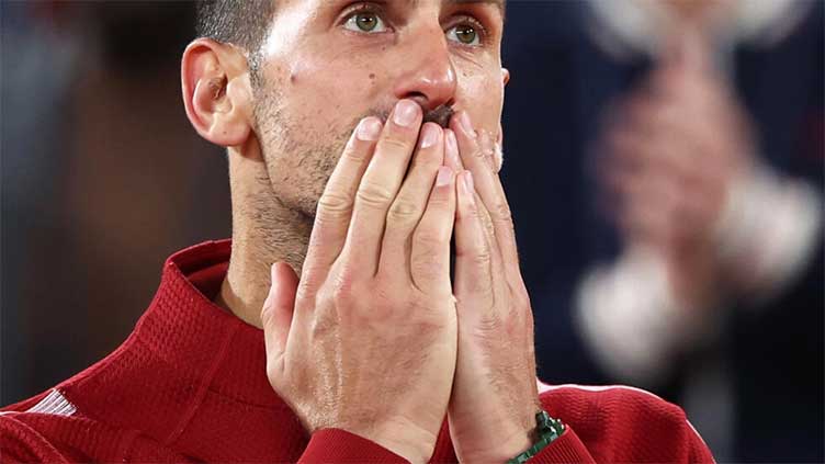 Marathon man Djokovic eyes 15th successive French Open quarter-final