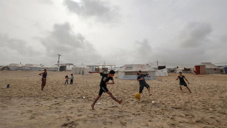 Dunya News Gaza boys turn to football to forget, for a moment, the war