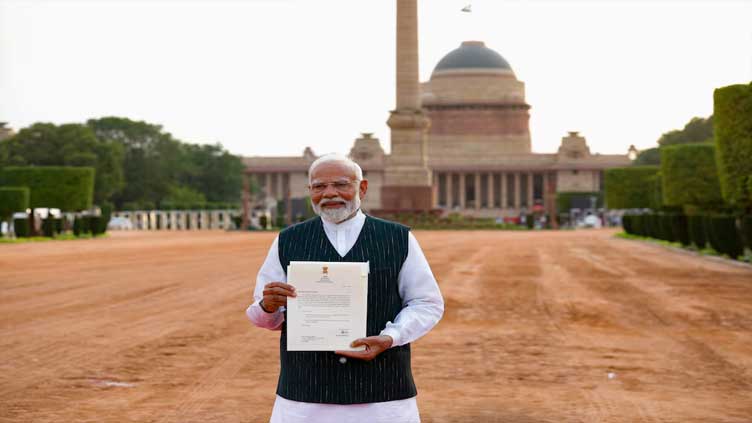 India's president invites Modi to head new coalition government