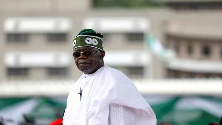Nigeria's president says economic reforms will continue despite hardships