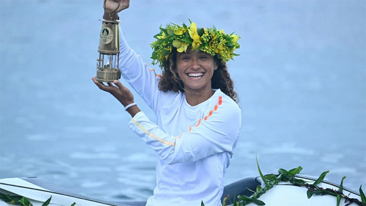 Olympic torch odyssey reaches the surf of Tahiti
