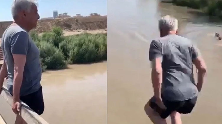 Khawaja Asif cools off in Motra Canal amidst sweltering heat