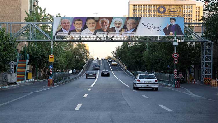 Two hardline candidates drop out on eve of Iran's presidential race