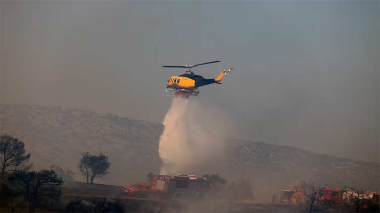 Greek firefighters battle new wildfire near Athens amid strong winds