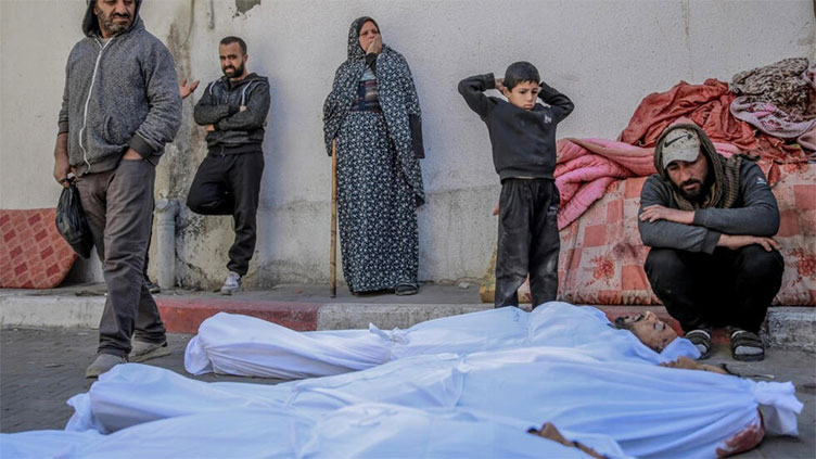 More than 100 killed while seeking aid in Gaza, overall death toll passes 30,000