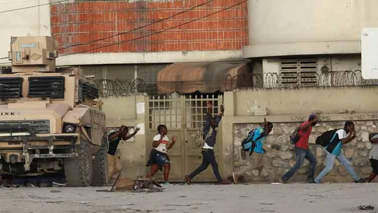 Violence rocks Haiti as prime minister visits Kenya
