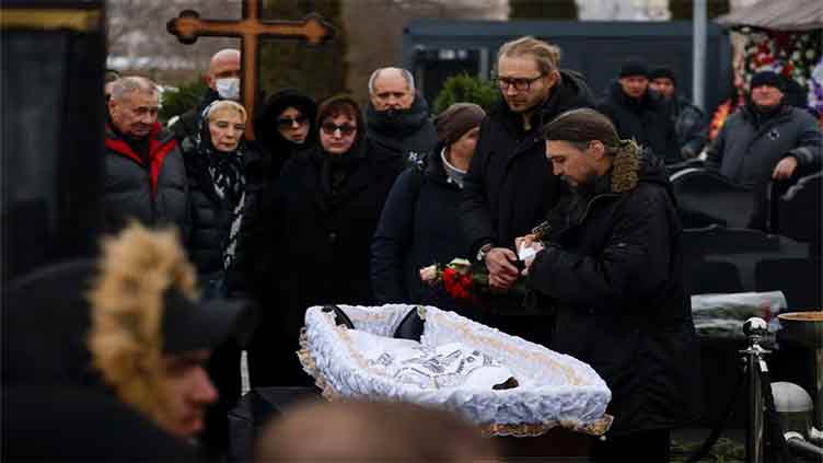 Navalny's parents bury their son as thousands chant his name