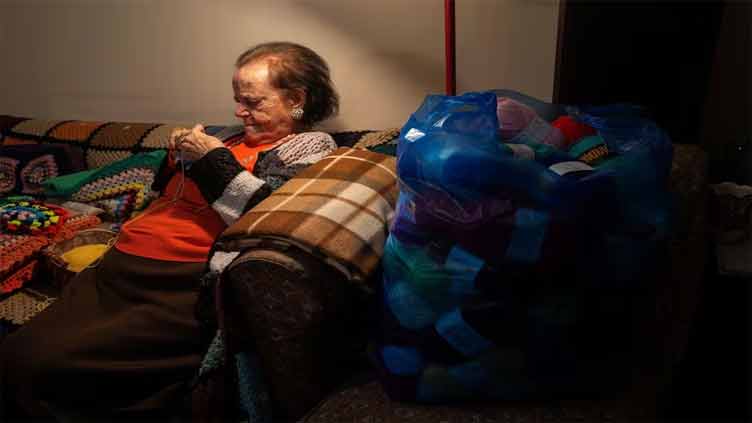 A 93-year-old Greek grandmother's scarves travel to children in need