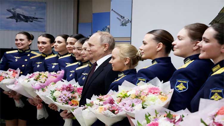 Putin lauds Russian women for motherhood, beauty