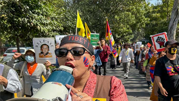 Hundreds of Tibetans march on New Delhi streets asking China to leave Tibet on uprising anniversary