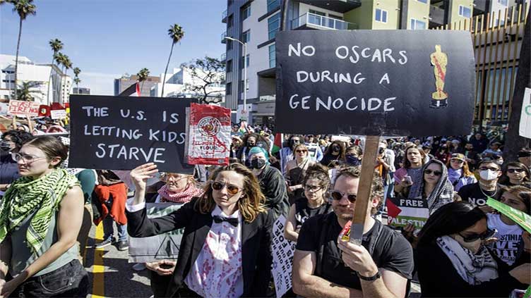 Protesters disrupt Oscars red carpet