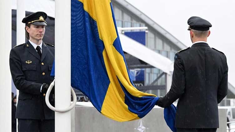 Sweden's flag raised over NATO headquarters as membership cemented
