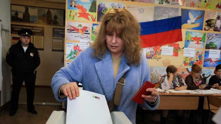 Russians head to polls for Day 2 of election marred by attacks, acts of protest