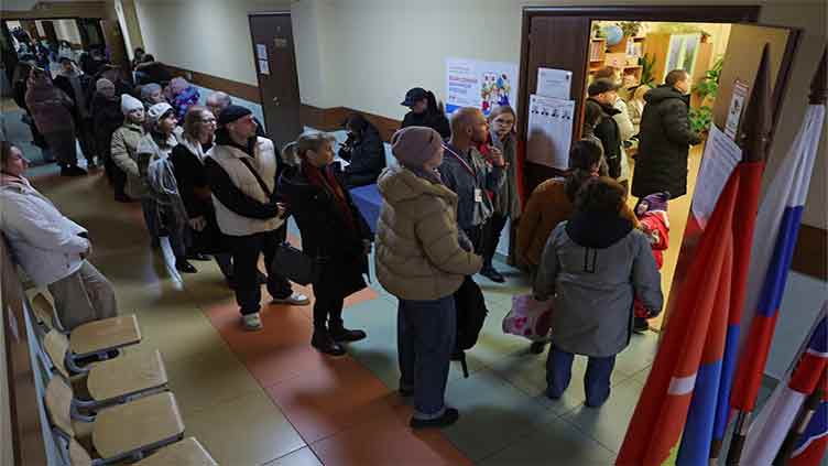 Russia election to tighten Putin's grip, opponents stage noon protest