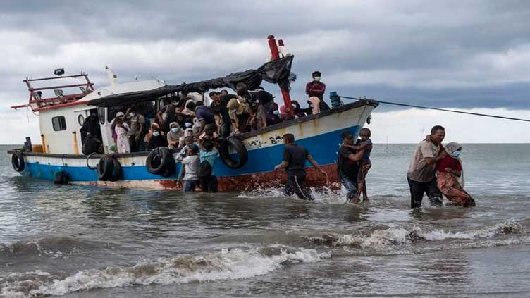 Indonesian fishermen rescue dozens of Rohingya after boat capsizes