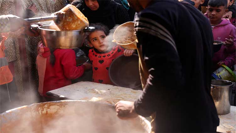 With no chance to celebrate Ramazan, Gazans gather at soup kitchens