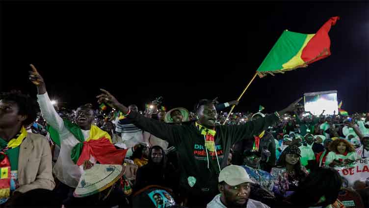 Senegalese voters go to the polls in delayed presidential election