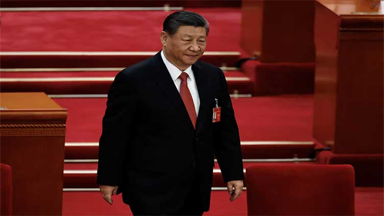 China's President Xi meets US executives, academics in Beijing