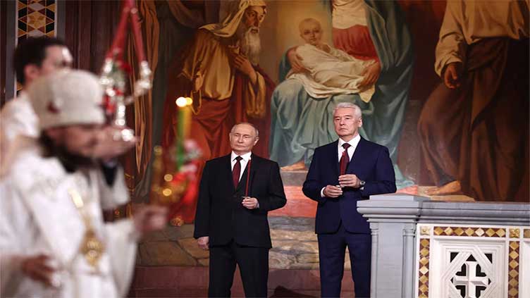 Putin attends Easter service led by head of Russia's Orthodox Church