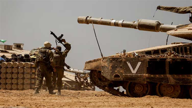 Israeli forces mass on Rafah's outskirts as US warns a major assault could halt arms