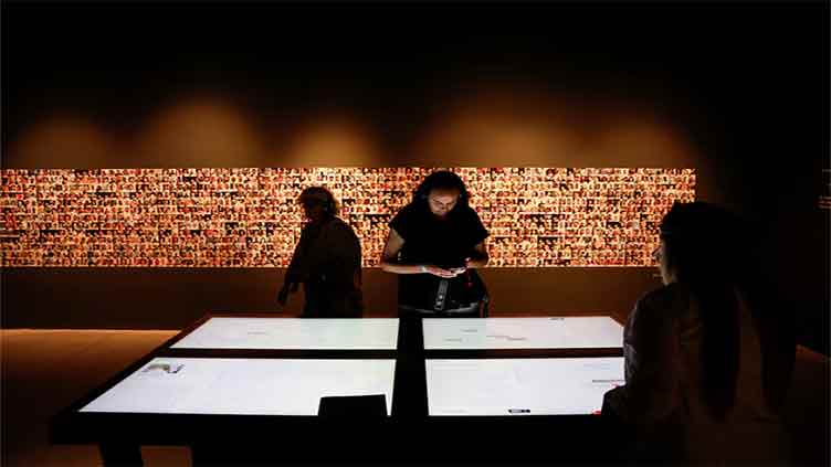 Interactive Israeli exhibition tells Oct 7 survivor stories as virtually 34,000 Palestinians killed