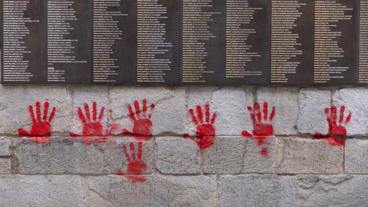 Paris Holocaust memorial hit with red hand graffiti