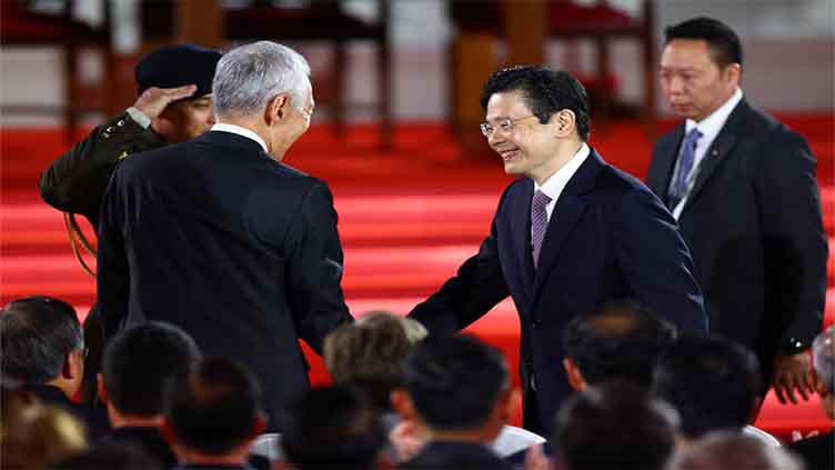 Singapore swears in its first new PM in 2 decades