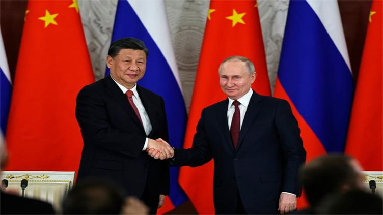 Putin arrives in Beijing seeking greater support for war effort