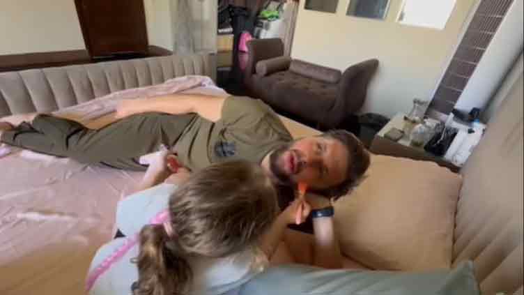 A doting father: Arwa tests her makeup skills on Shahid Afridi